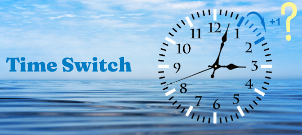 A clock face is superimposed over a background of water and sky. Text reads Time Switch
