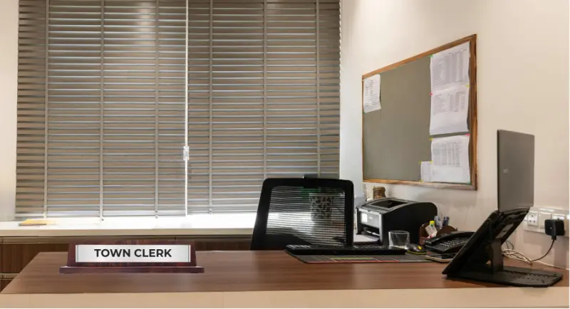 An empty clerk's office counter, illustrating the staffing gap many small municipalities are now facing.